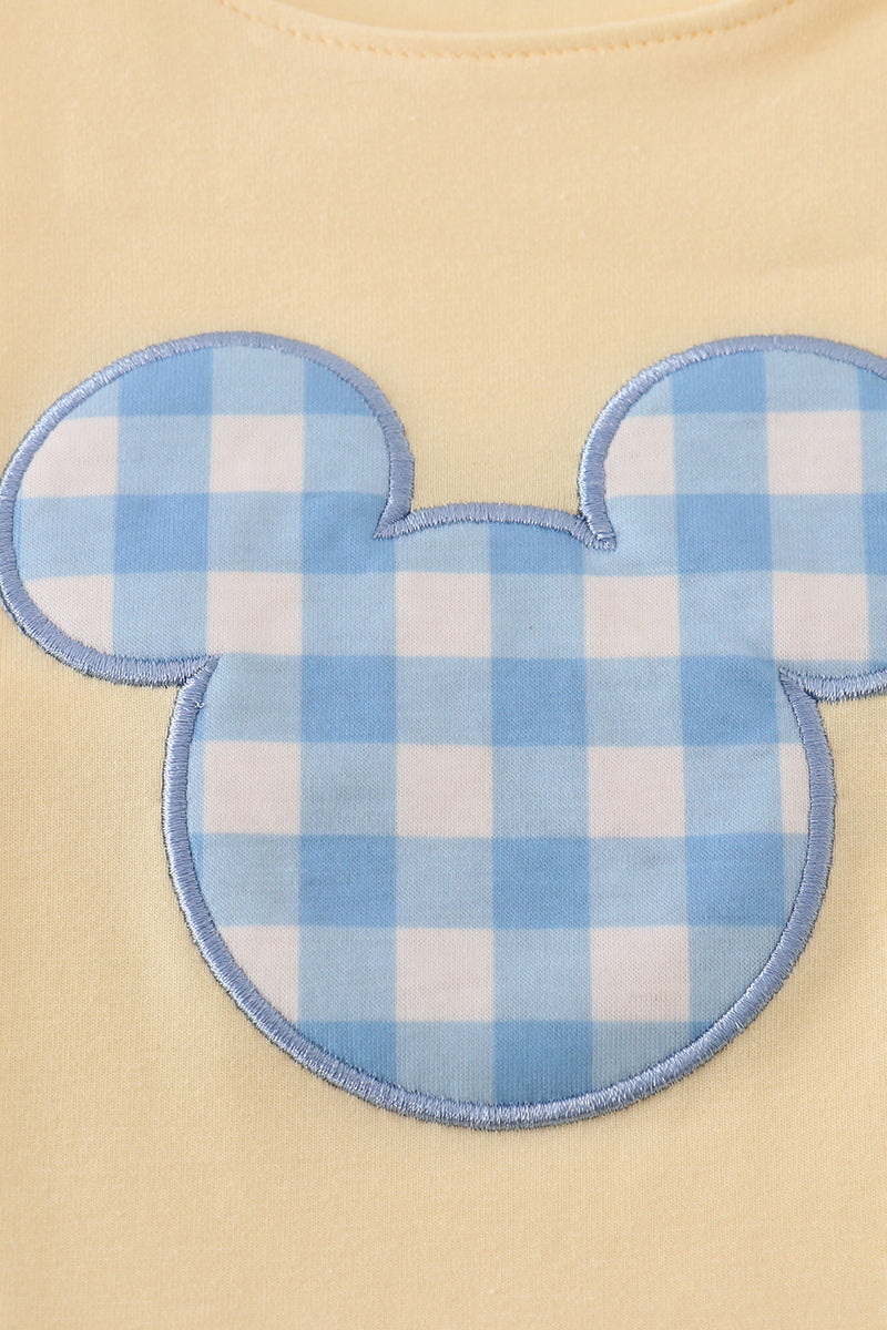 Yellow character applique bubble